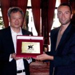 Ang Lee receives the first Career Achievement Queer Lion Award from the hands of Daniel N. Casagrande, creator of the award