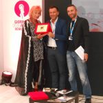Zazie de Paris posing with Queer Lion trophy, along with jury members Alessandro Zan and Daniel N. Casagrande