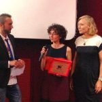 September 7th, 2013. Alessandra Tieri, representing Lucky Red, receives the Queer Lion Award 2013 for "Philomena", directed by Stephen Frears. With QL director Daniel N. Casagrande, Sen. Josefa Idem